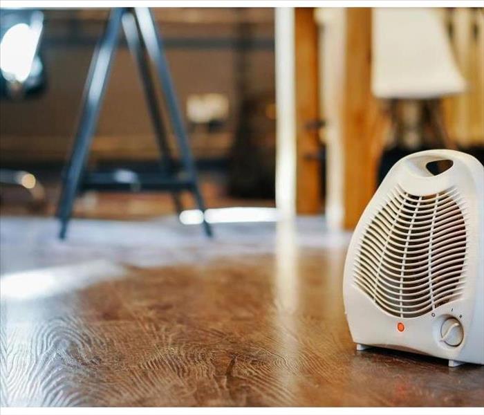 A space heater that is properly placed heating that area up. 