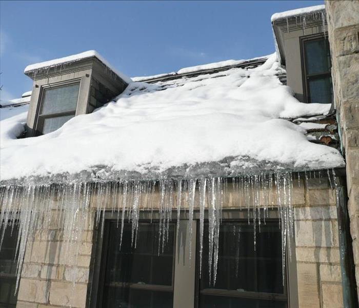 A house that has been affected by an ice dam. 