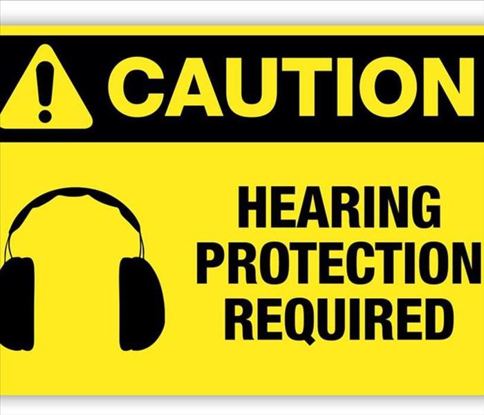 A caution sign about wearing hearing protection. 